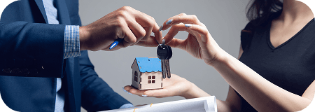 Hands exchanging house keys